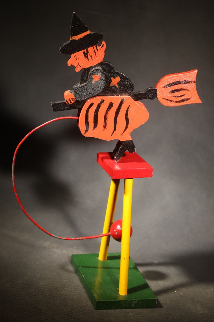 Vintage Painted Wooden Halloween Balancing Witch on Broomstick with Wire and Ball Counterweight, Circa 1990s