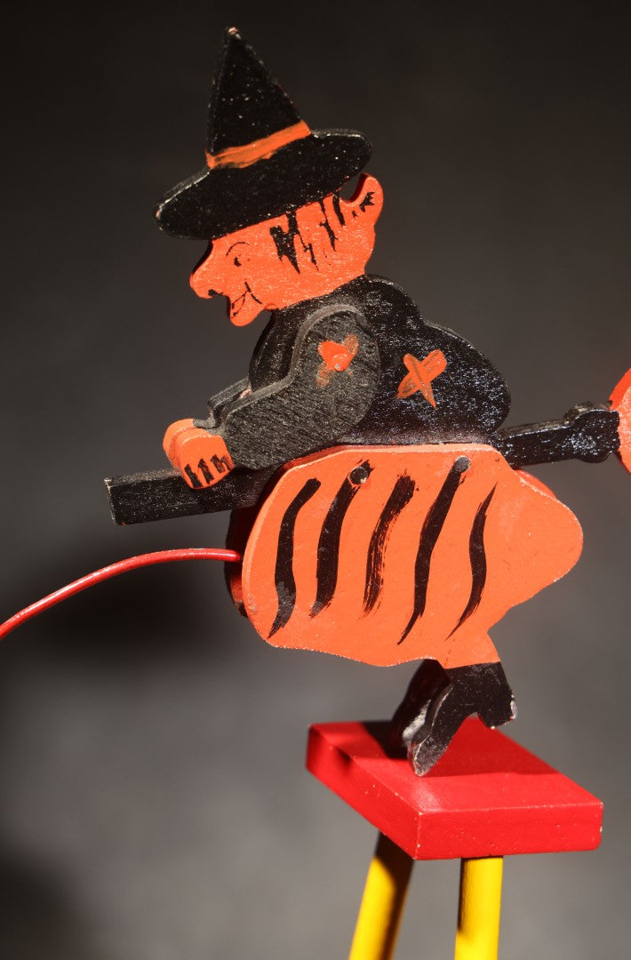 Vintage Painted Wooden Halloween Balancing Witch on Broomstick with Wire and Ball Counterweight, Circa 1990s
