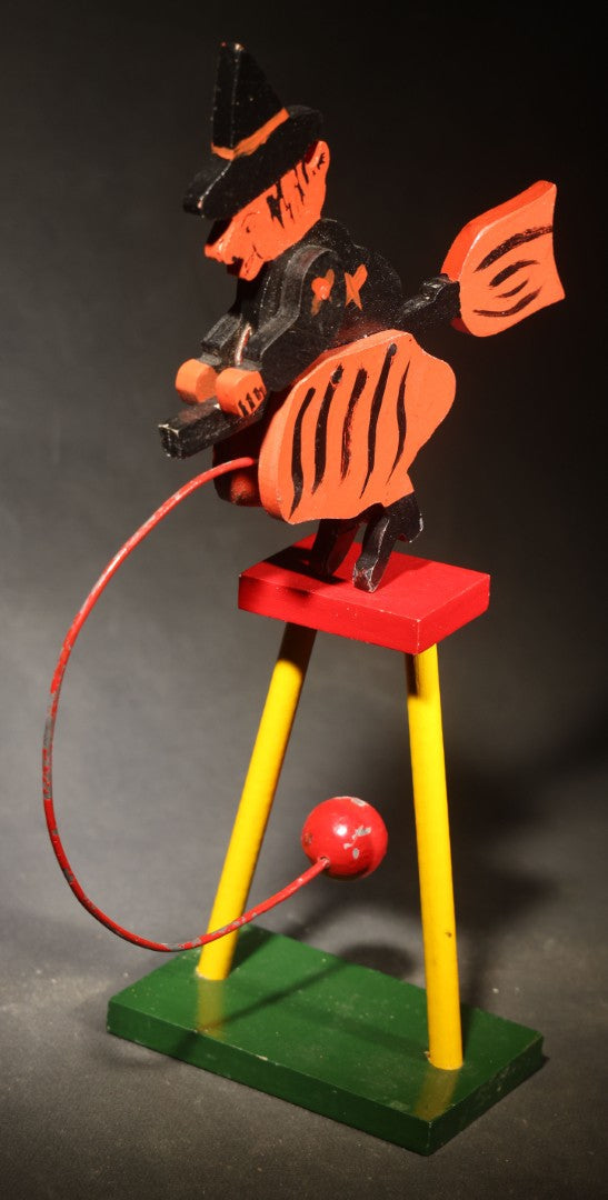 Vintage Painted Wooden Halloween Balancing Witch on Broomstick with Wire and Ball Counterweight, Circa 1990s