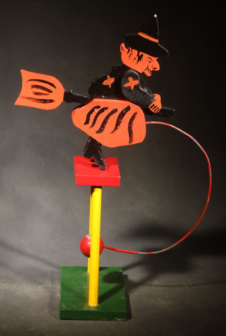 Vintage Painted Wooden Halloween Balancing Witch on Broomstick with Wire and Ball Counterweight, Circa 1990s