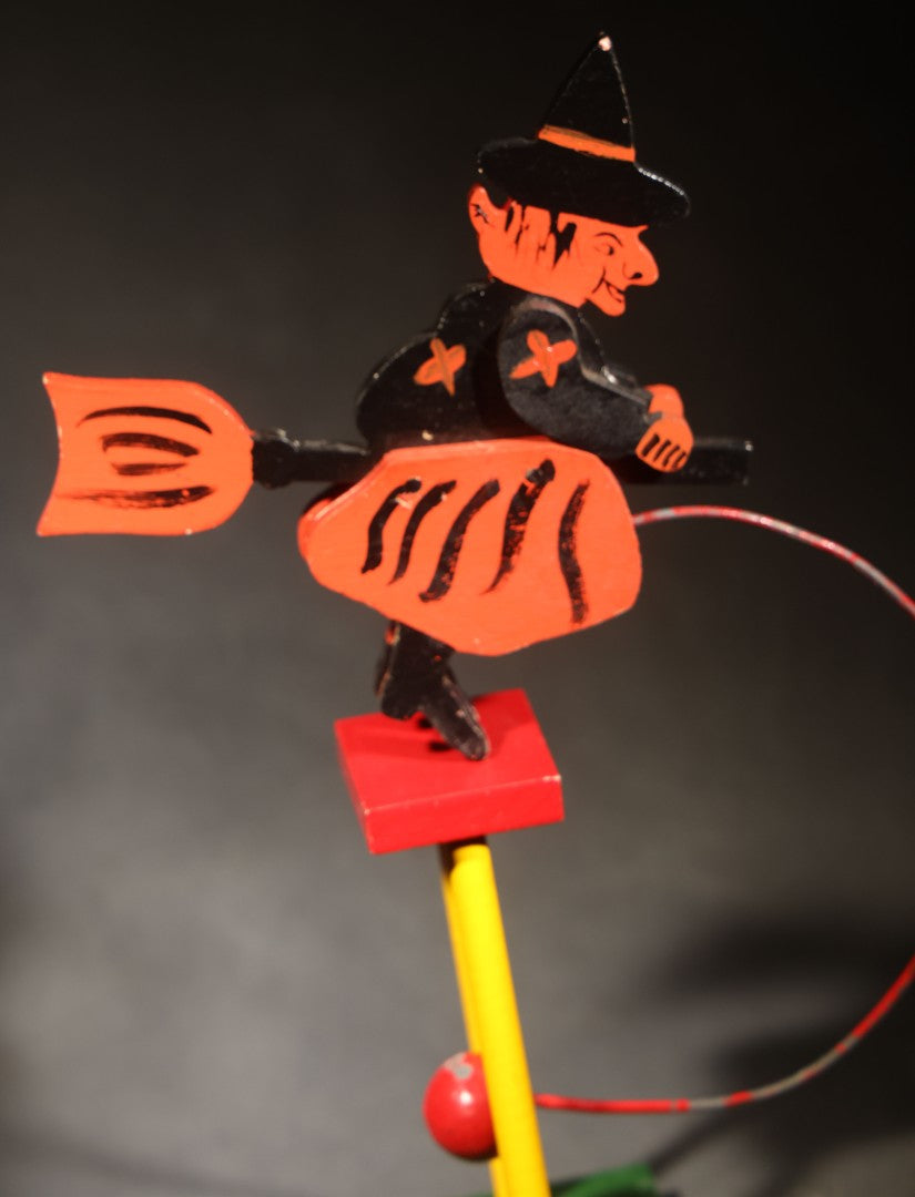 Vintage Painted Wooden Halloween Balancing Witch on Broomstick with Wire and Ball Counterweight, Circa 1990s