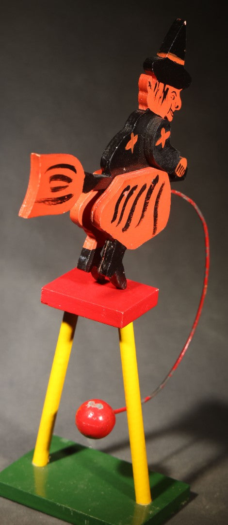 Vintage Painted Wooden Halloween Balancing Witch on Broomstick with Wire and Ball Counterweight, Circa 1990s