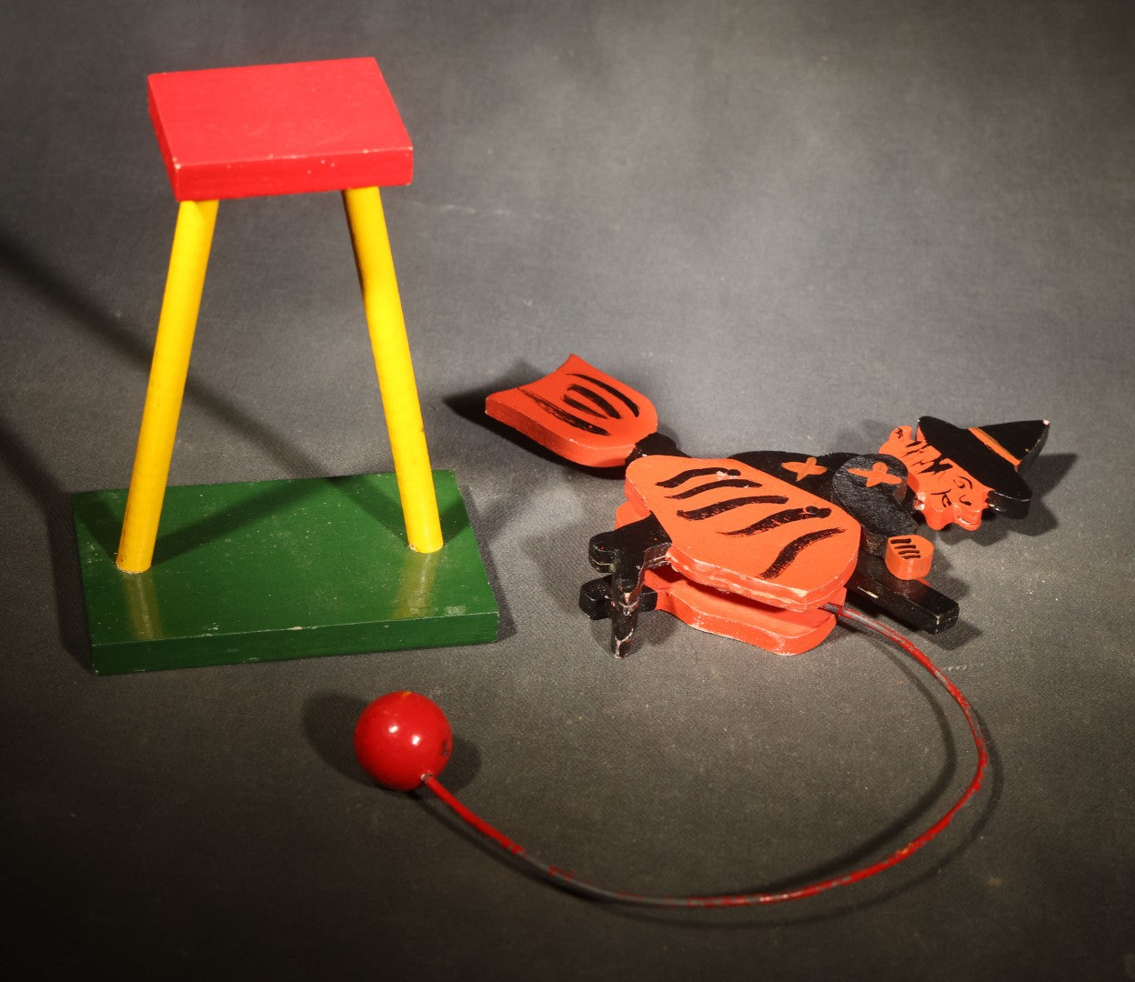 Vintage Painted Wooden Halloween Balancing Witch on Broomstick with Wire and Ball Counterweight, Circa 1990s