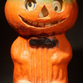 Lot 037 - Vintage Papier-Mache / Paper Pulp Halloween Grinning Jack-O-Lantern Pumpkin Man Lantern with Black Bow Tie and Original Paper Insert, 7-1/2" H