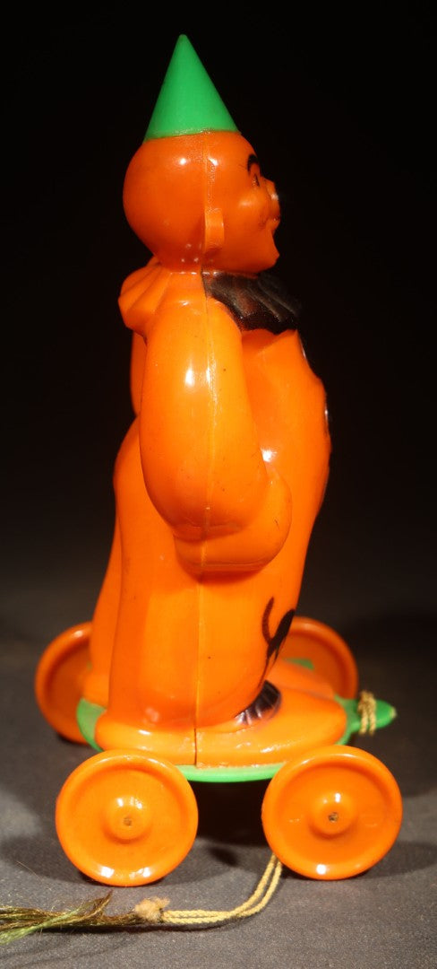 Vintage Plastic Halloween Clown Pull Toy Candy Container, Circa 1950s, Manufactured by Rosbro Plastics, Pawtucket, Rhode Island (Green Hat & Base)