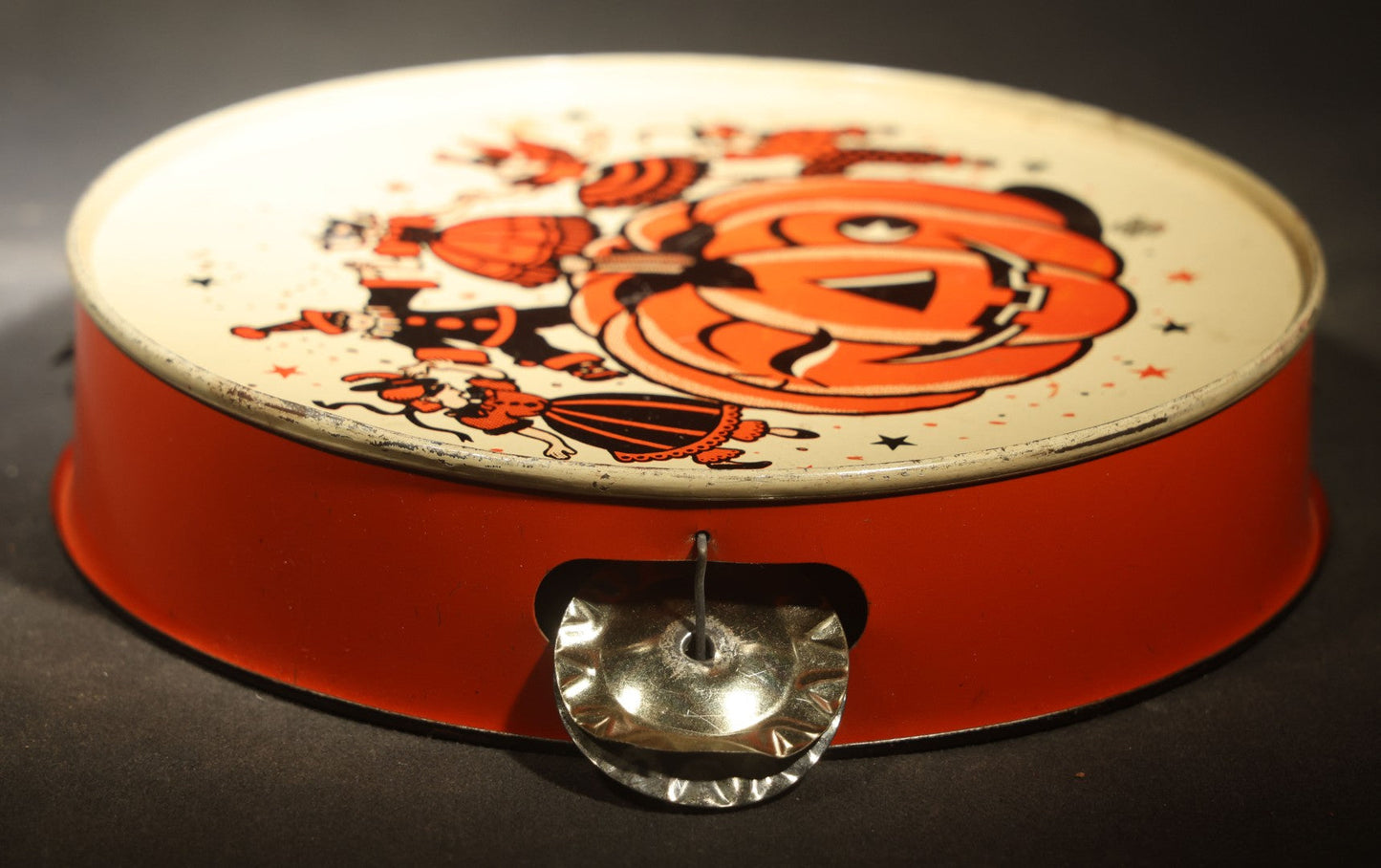 Vintage Halloween Tin Lithograph Toy Tambourine Noisemaker with Jack-O-Lantern Pumpkin and Costume Parade Graphics, Manufactured by U.S. Metal Toy Mfg. Co., Made in U.S.A.