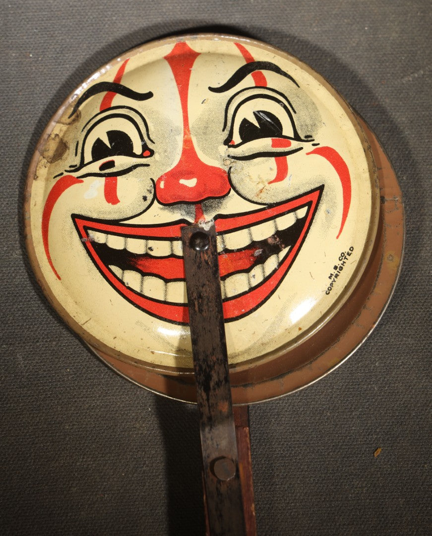 Vintage Tin Lithograph Clapper Noisemaker with Halloween Clown Face Graphics, Manufactured by M.B. Co.