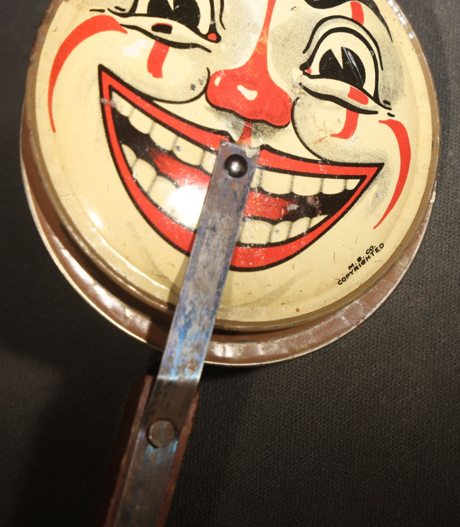 Vintage Tin Lithograph Clapper Noisemaker with Halloween Clown Face Graphics, Manufactured by M.B. Co.