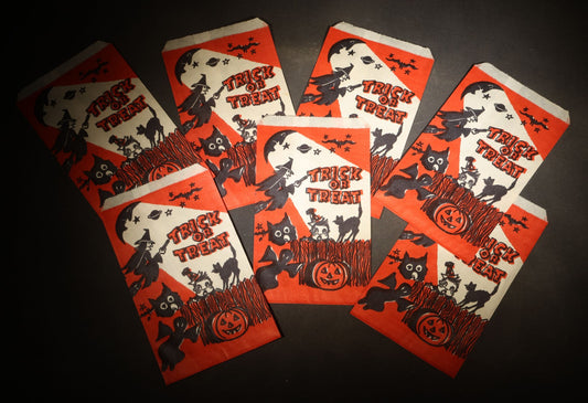 Grouping of Seven Vintage Halloween "Trick or Treat" Paper Candy Bags with Witch, Ghost, Black Cats, Jack-O-Lantern, and Bats Graphics