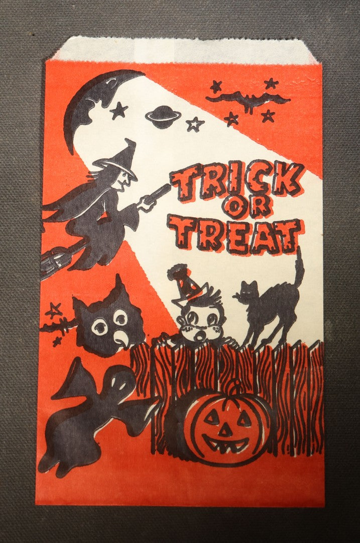 Grouping of Seven Vintage Halloween "Trick or Treat" Paper Candy Bags with Witch, Ghost, Black Cats, Jack-O-Lantern, and Bats Graphics
