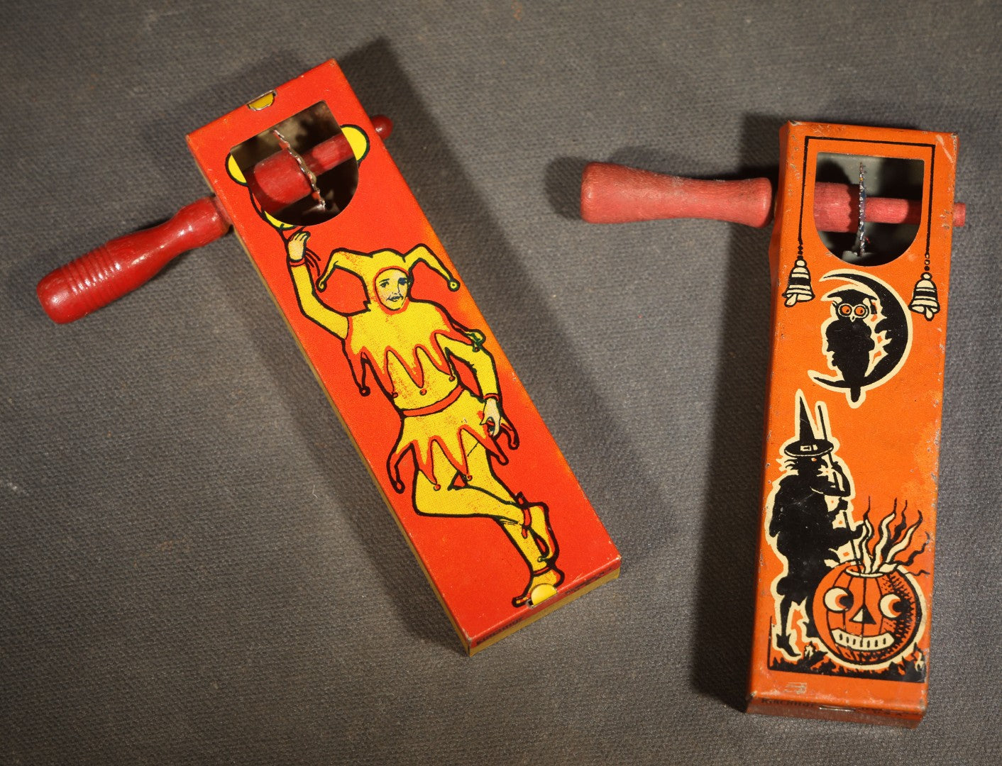 Pair of Vintage Tin Lithograph Ratchet Noisemakers including Halloween Witch, Owl, Crescent Moon, and Jack-O-Lantern and Jester / Harlequin, Manufactured by Kirchhof, Newark, New Jersey
