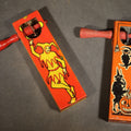 Lot 066 - Pair of Vintage Tin Lithograph Ratchet Noisemakers Including Halloween Witch, Owl, Crescent Moon, and Jack-O-Lantern and Jester / Harlequin, Manufactured by Kirchhof, Newark, New Jersey, 4-1/2" L each