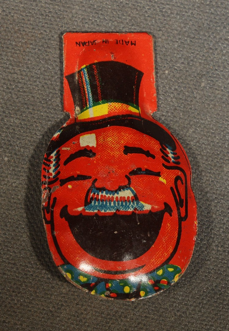 Trio of Vintage Party Favor Noisemakers including Two Halloween Paper Pipe Blowouts and Tin Lithograph Laughing Man in Top Hat Clicker, Japan