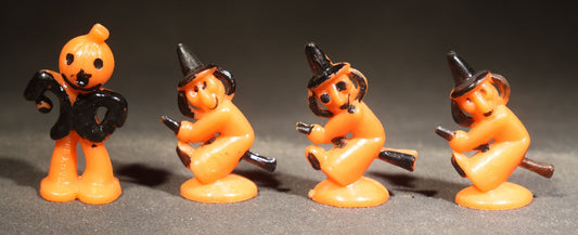Grouping of Four Vintage Plastic Halloween Cupcake Toppers including Jack-O-Lantern Pumpkin Head Figure and Three Witches on Broomsticks, Hong Kong