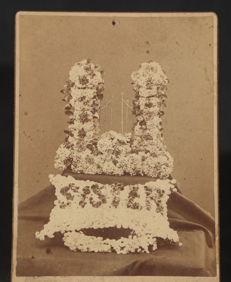 Antique Cabinet Card Photograph of Funerary Floral Arrangements with "Sister" Flower Pillow and Gates of Heaven Display, Inscribed "Flowers at Aunt Lou's Funeral"