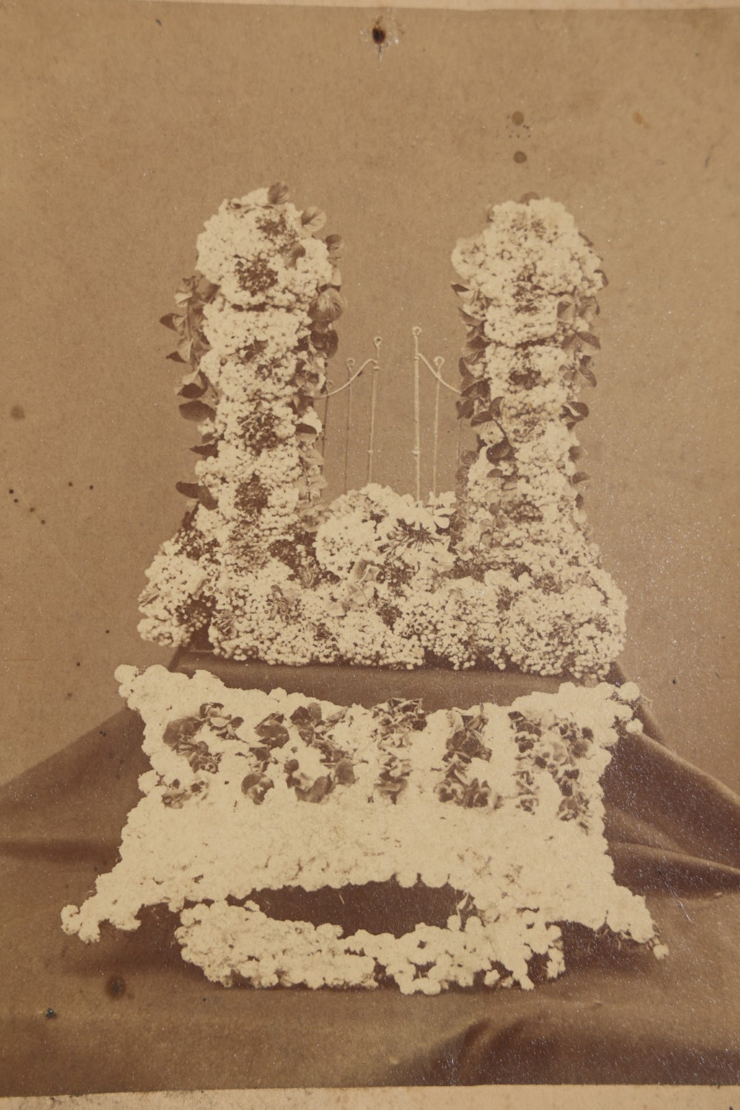 Antique Cabinet Card Photograph of Funerary Floral Arrangements with "Sister" Flower Pillow and Gates of Heaven Display, Inscribed "Flowers at Aunt Lou's Funeral"