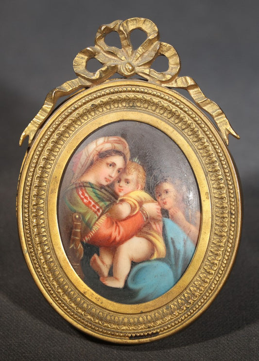 Antique Miniature Painting on Porcelain after Raphael's "Madonna della Seggiola," in Gilt Brass Oval Frame with Ribbon Bow Crest