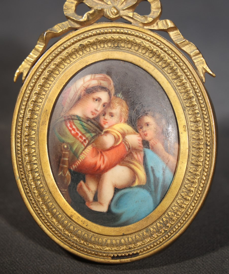 Antique Miniature Painting on Porcelain after Raphael's "Madonna della Seggiola," in Gilt Brass Oval Frame with Ribbon Bow Crest