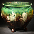 Lot 016 - Antique Weller Pottery "Sirens of the Sea" Majolica Jardiniere in Green and Brown Glaze on Scroll Feet, Note Poor Condition, 8" H