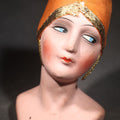 Lot 024 - Antique Hand-Painted Half-Doll Bust with Orange Fabric Cap and Gold Metallic Trim, 4" H