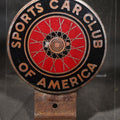 Lot 025 - Vintage Sports Car Club of America S.C.C.A. Car Badge with Wire Spoke Wheel Graphic