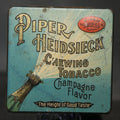 Lot 031 - Antique Piper Heidsieck Champagne Flavor Chewing Tobacco Tin with Champagne Bottle Graphic, the American Tobacco Company, Factory No. 27, Kentucky, 3" L