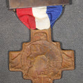 Lot 038 - Antique New Hampshire Award for Service in World War I Bronze Cross Medal with Red, White, and Blue Ribbon, 1917-1919, Old Man of the Mountain Design