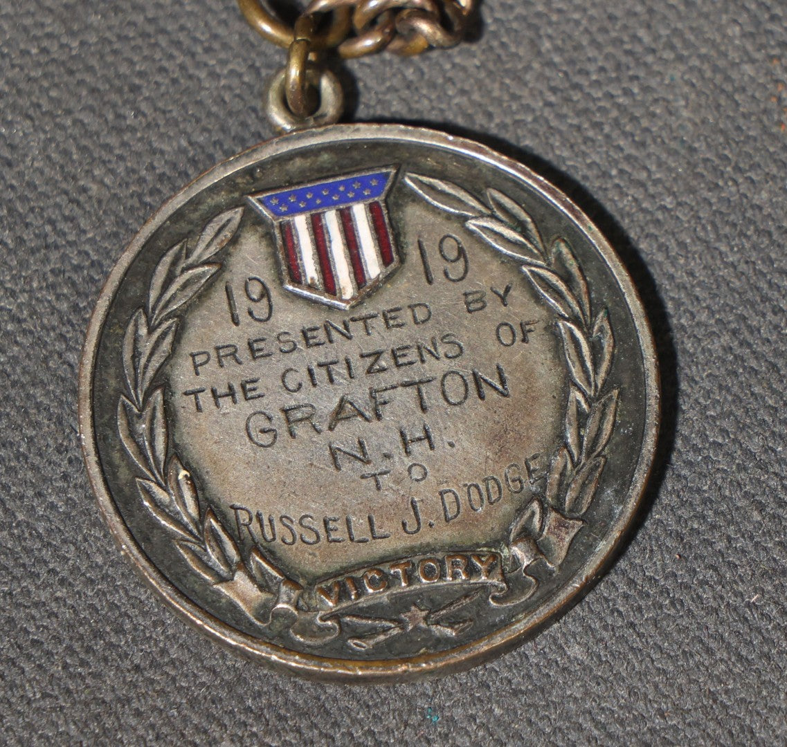 Antique World War I Victory Medal on Watch Chain, Presented by the Citizens of Grafton, New Hampshire to Russell J. Dodge, Enameled American Shield and Laurel Wreath, 1919