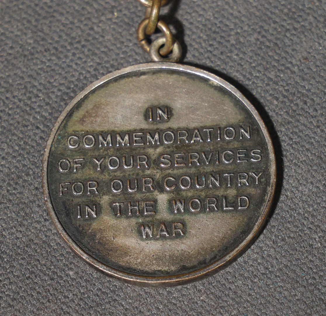 Antique World War I Victory Medal on Watch Chain, Presented by the Citizens of Grafton, New Hampshire to Russell J. Dodge, Enameled American Shield and Laurel Wreath, 1919
