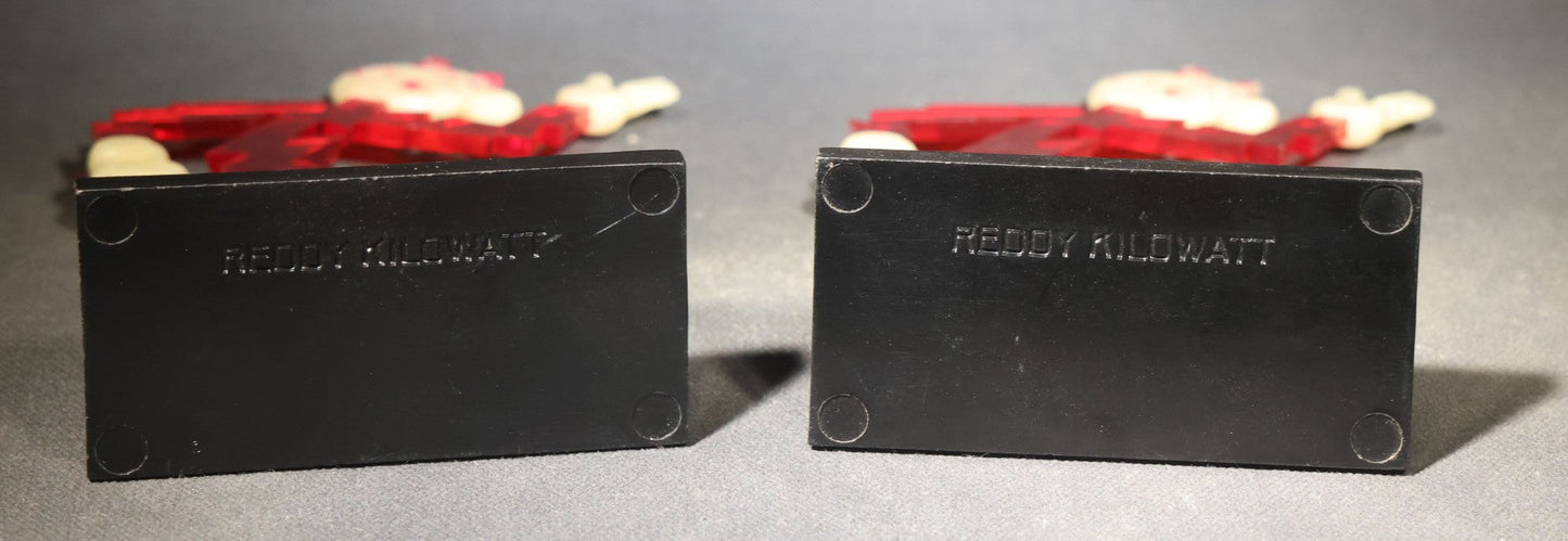 Pair of Vintage Reddy Kilowatt Figural Display Advertising Pieces, Red Lightning Bolt Body with Cream Head, Hands, and Feet on Black Base, Circa 1950s-1960s