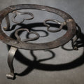 Lot 054 - Antique Wrought Iron Footed Trivet with Heart-Shaped Scrollwork Design, 7-1/4" W