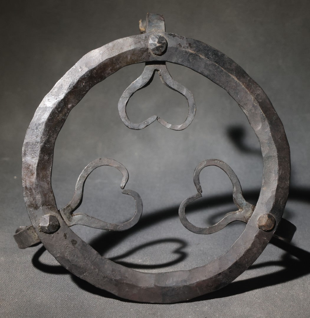 Antique Wrought Iron Footed Trivet with Heart-Shaped Scrollwork Design