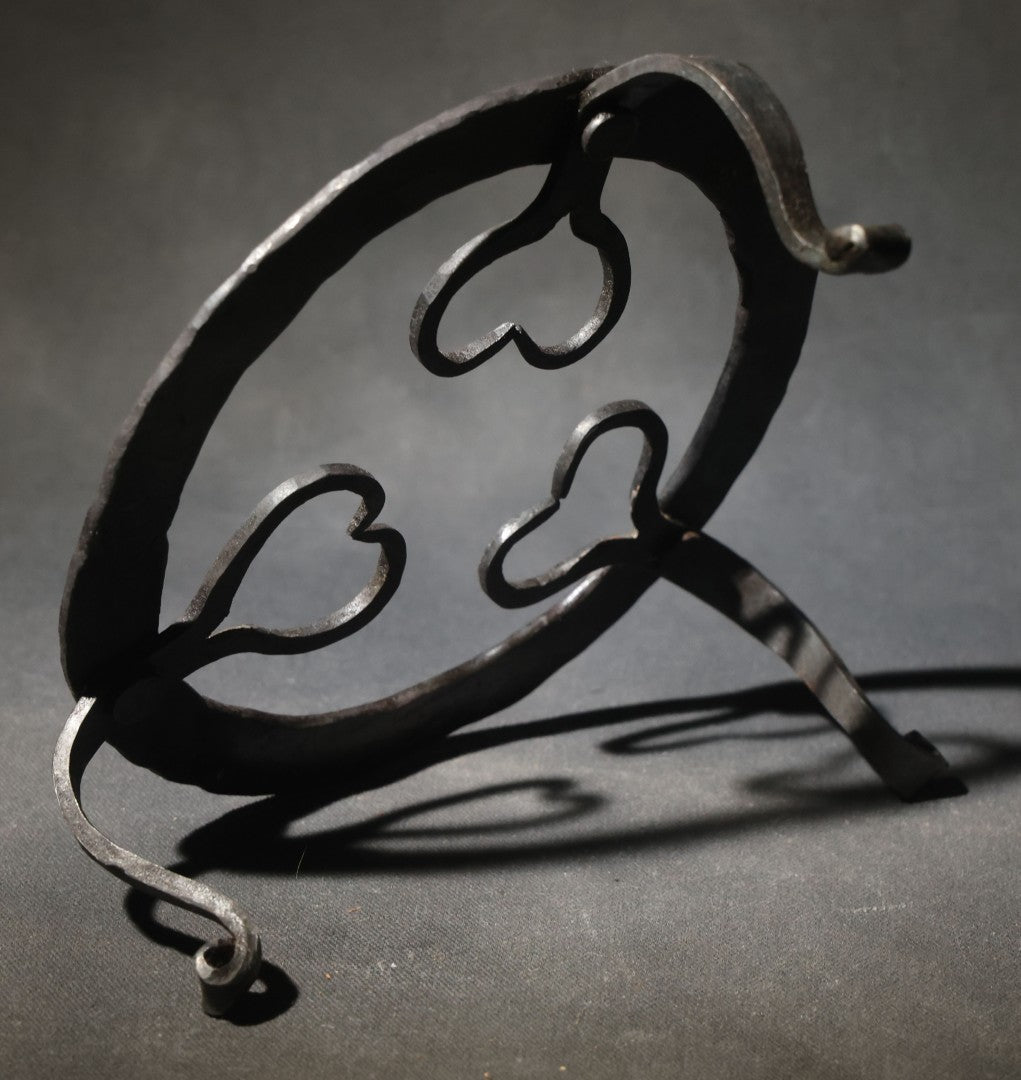 Antique Wrought Iron Footed Trivet with Heart-Shaped Scrollwork Design