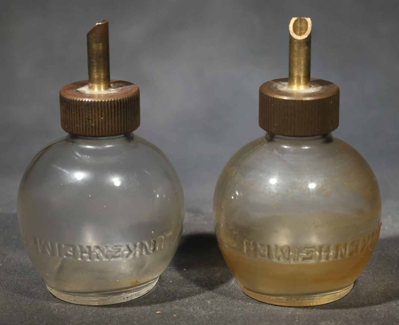 Pair of Vintage Lunkenheimer Glass Oiler Bottles with Brass Spouts