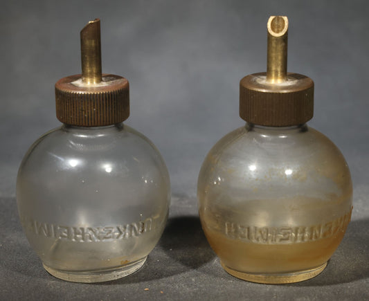 Pair of Vintage Lunkenheimer Glass Oiler Bottles with Brass Spouts