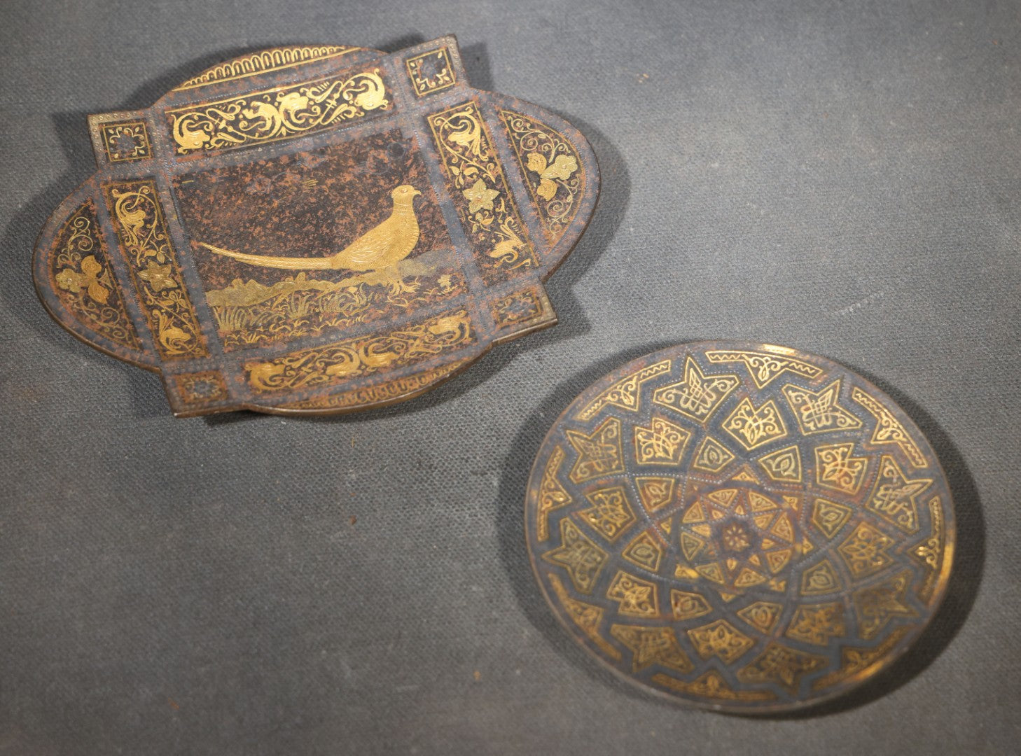Pair of Vintage Gold Damascene Dishes including Round Footed Dish with Geometric Star Pattern and Shield-Shaped Dish with Bird and Scrollwork