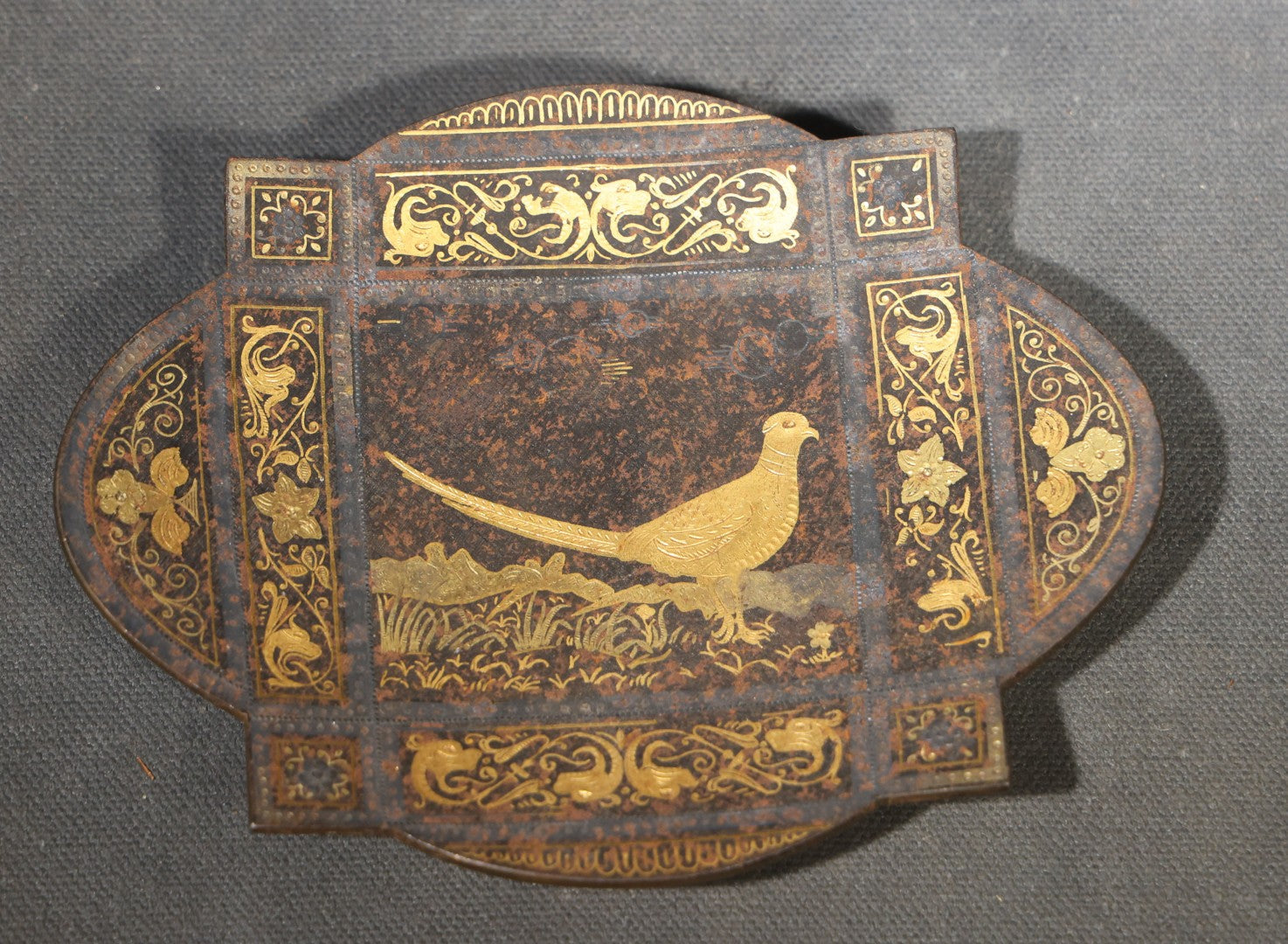 Pair of Vintage Gold Damascene Dishes including Round Footed Dish with Geometric Star Pattern and Shield-Shaped Dish with Bird and Scrollwork
