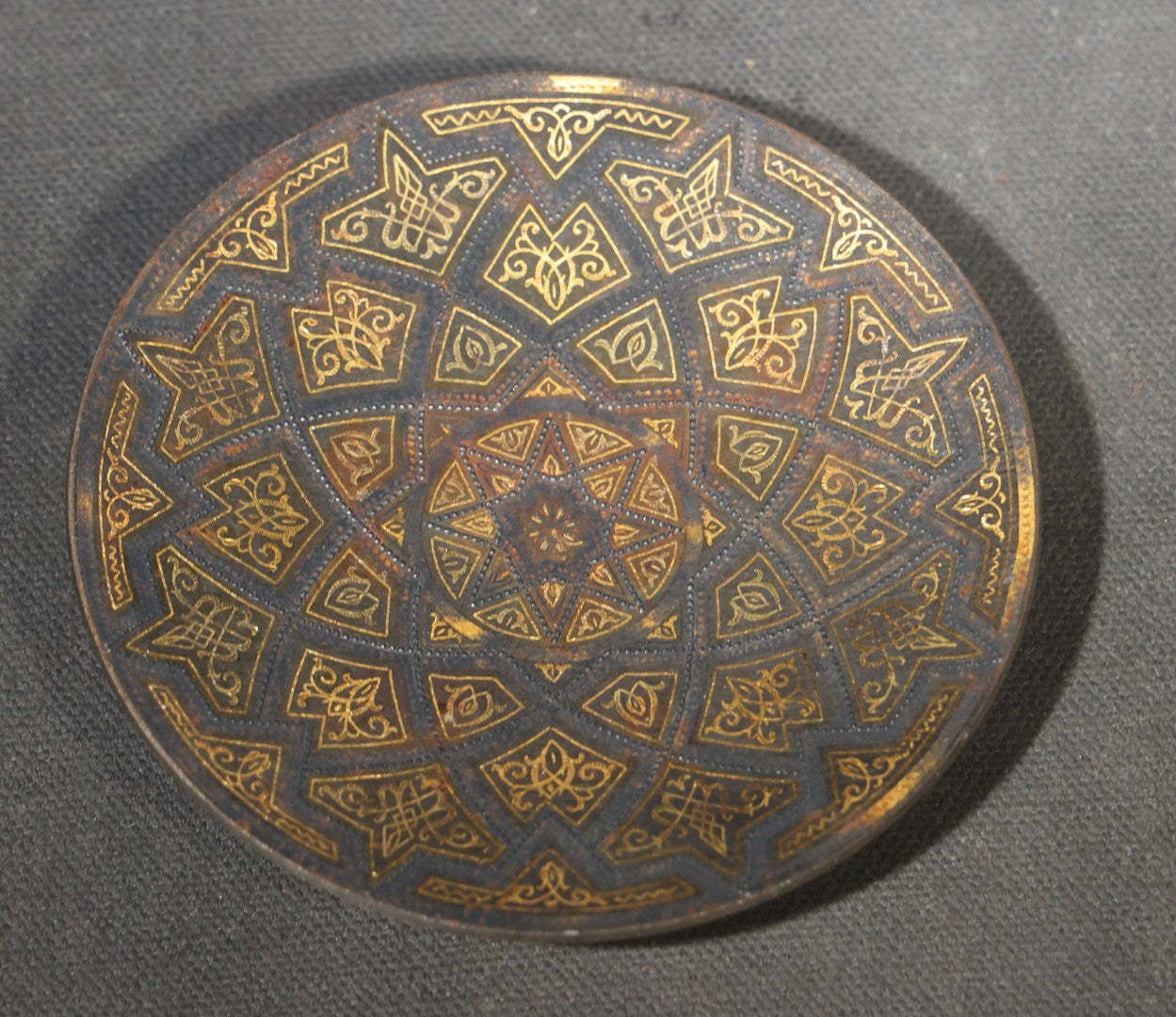 Pair of Vintage Gold Damascene Dishes including Round Footed Dish with Geometric Star Pattern and Shield-Shaped Dish with Bird and Scrollwork