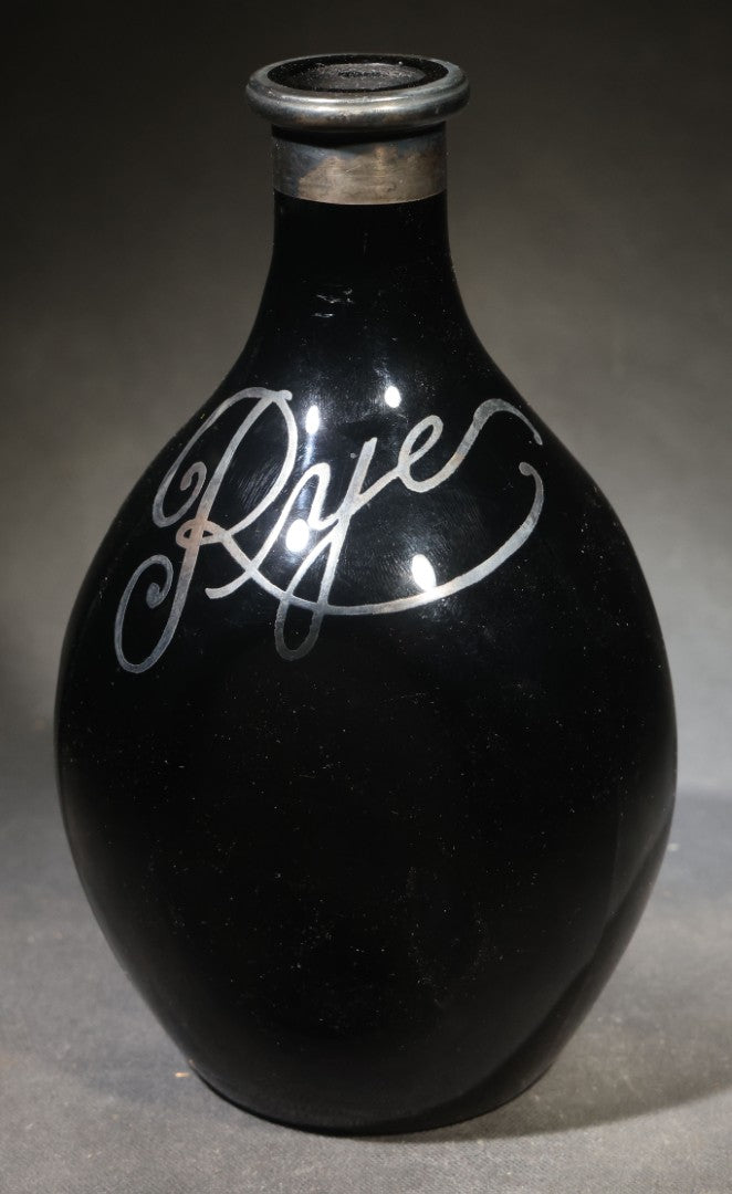 Antique Black Glass "Rye" Back Bar Bottle with Silver Overlay Script Lettering, Pinched Body, and Metal Collar