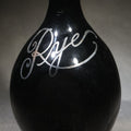 Lot 082 - Antique Black Glass "Rye" Back Bar Bottle with Silver Overlay Script Lettering, Pinched Body, and Metal Collar, 8" H