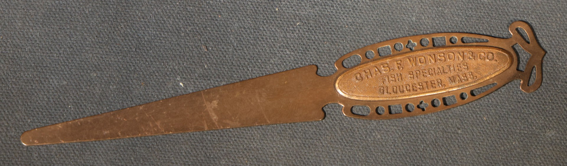 Antique Advertising Letter Opener for Chas. F. Wonson & Co., Fish Specialties, Gloucester, Massachusetts, with Pierced Handle Design