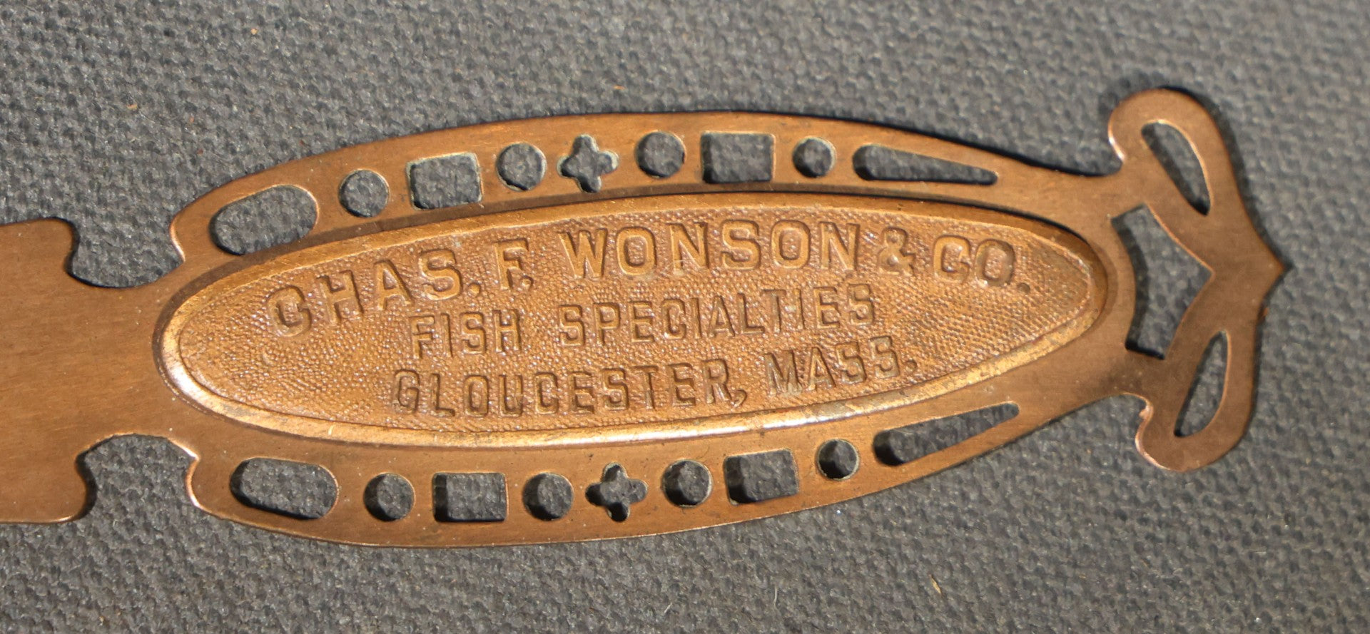 Antique Advertising Letter Opener for Chas. F. Wonson & Co., Fish Specialties, Gloucester, Massachusetts, with Pierced Handle Design