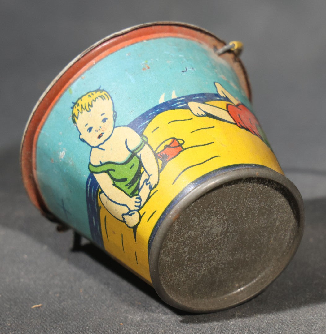 Vintage Tin Lithograph Toy Sand Pail with Beach Scene of Children Playing in Sand, Wire Bail Handle