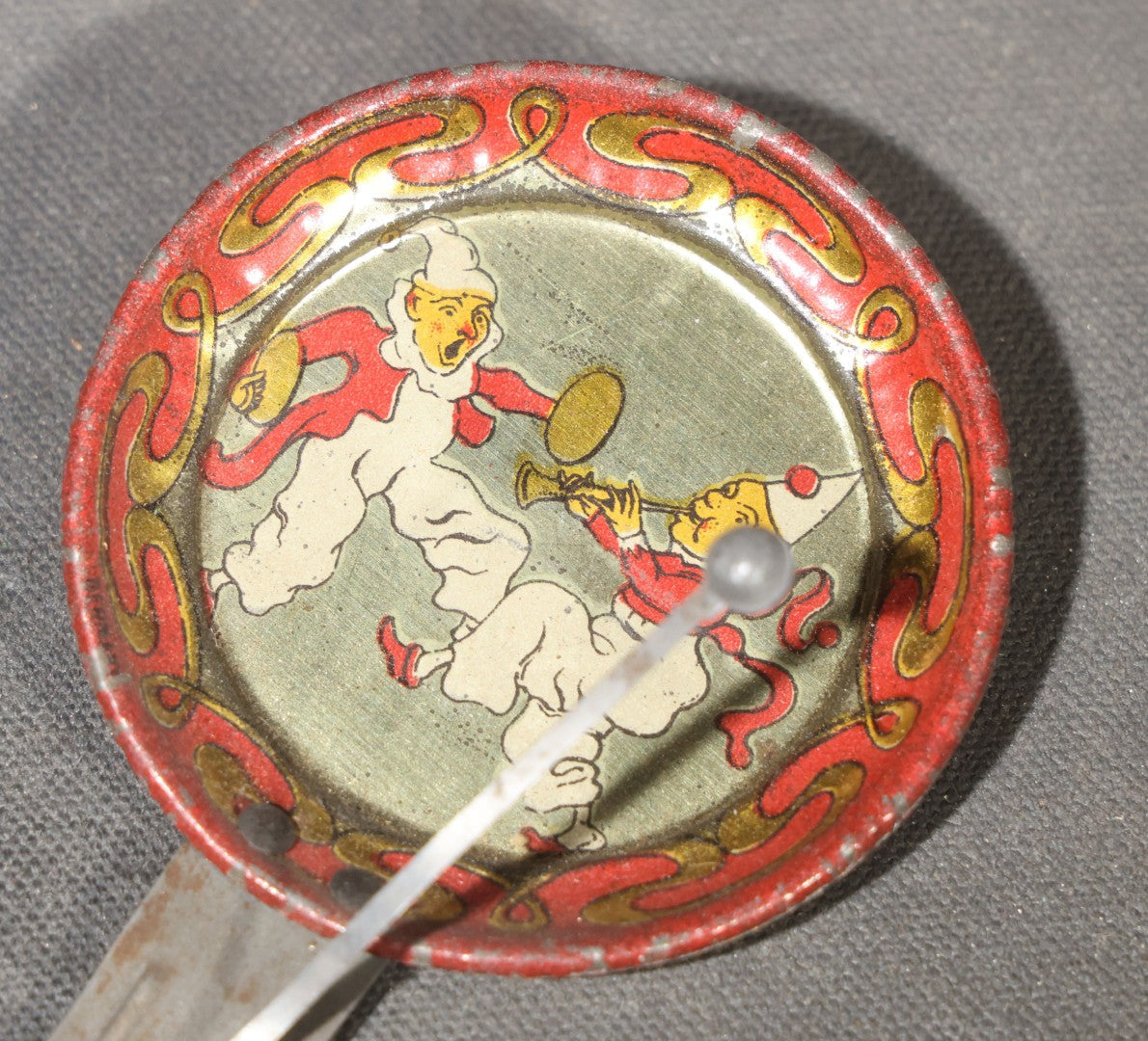 Vintage Tin Lithograph Clapper Noisemaker with Clown Graphics, Red and Gold Serpentine Border