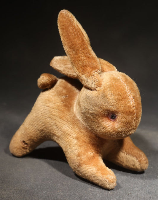 Vintage Stuffed Rabbit Toy with Glass Eyes and Cotton Tail in Crouching Pose
