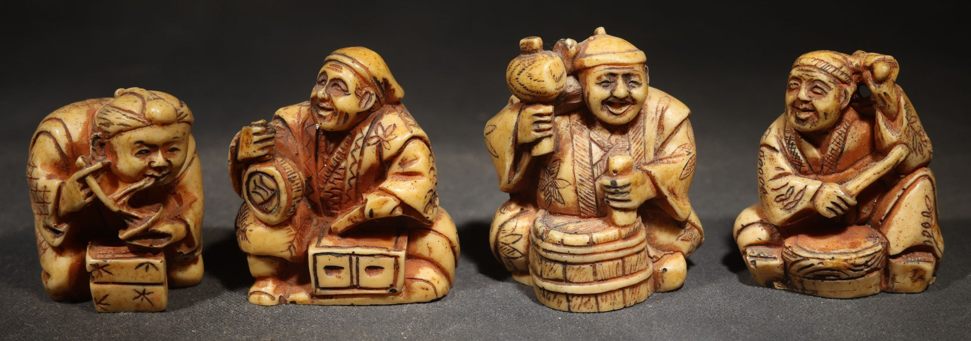 Grouping of Four Vintage Cast Resin Netsuke-Style Figurines, Seated Japanese Figures with Pipe, Gourd, Drum, and Drawers