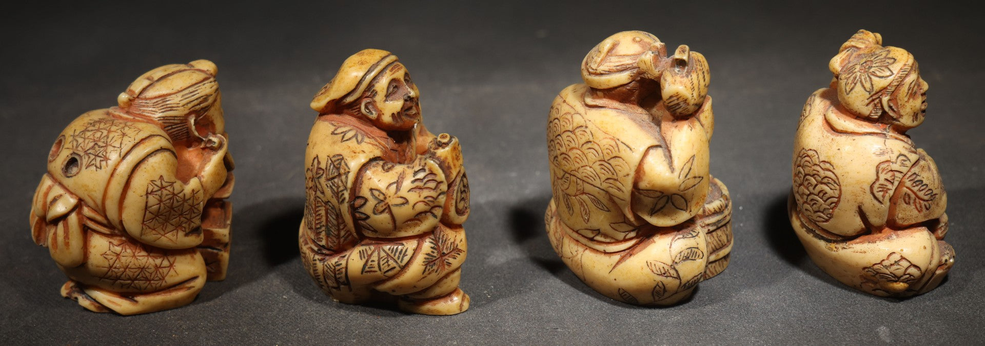 Grouping of Four Vintage Cast Resin Netsuke-Style Figurines, Seated Japanese Figures with Pipe, Gourd, Drum, and Drawers
