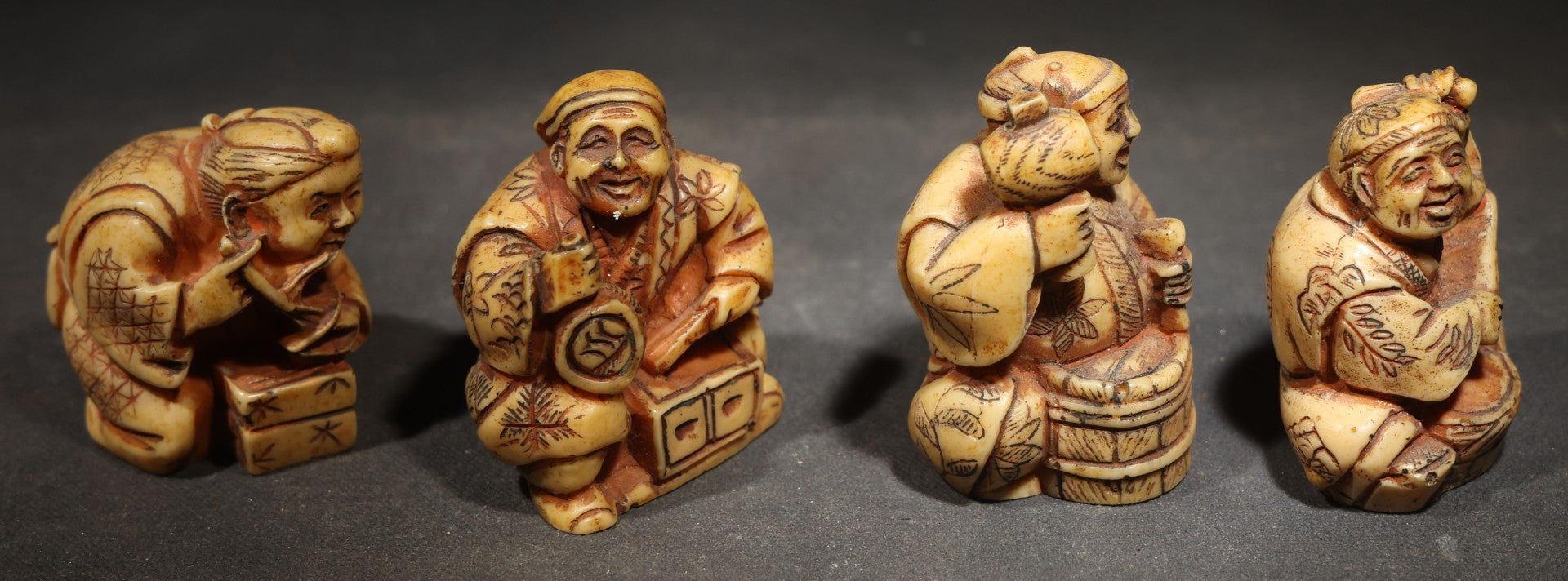 Grouping of Four Vintage Cast Resin Netsuke-Style Figurines, Seated Japanese Figures with Pipe, Gourd, Drum, and Drawers