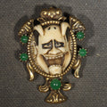 Lot 108 - Vintage Cast Resin Japanese Hannya Mask Brooch with Green Cabochons and Gold-Tone Scrollwork Setting, 1-5/8" H