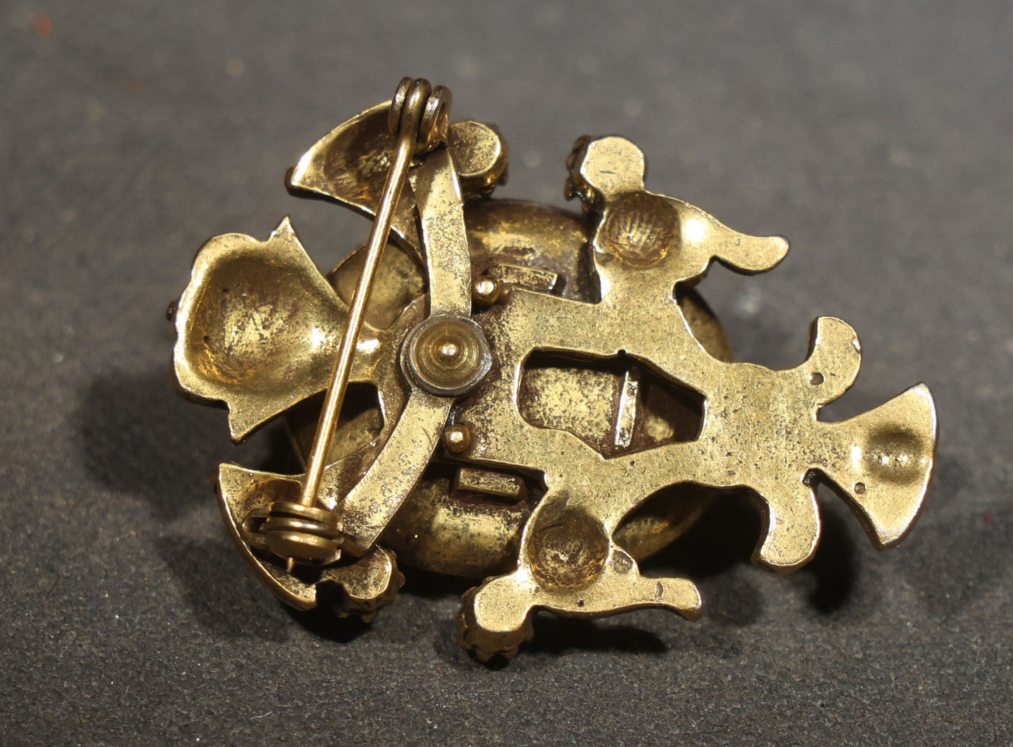 Vintage Cast Resin Japanese Hannya Mask Brooch with Green Cabochons and Gold-Tone Scrollwork Setting